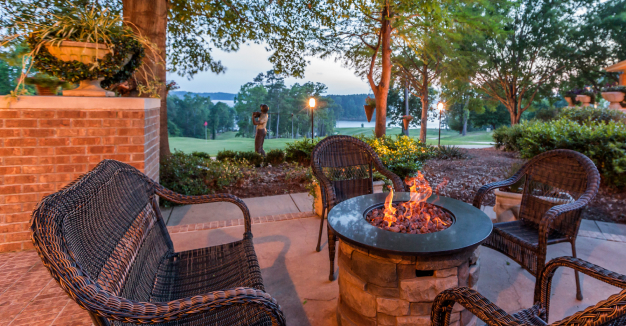 An outdoor fire pit overlooking the golf course.